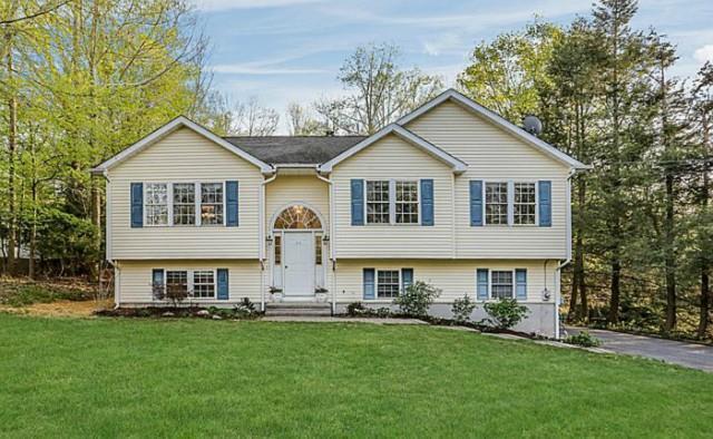 29 Greenview Road New Milford, CT 06776 - Photo 1 of 1 a front view of house with yard and green space