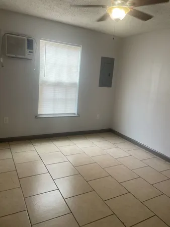 a view of a livingroom and window