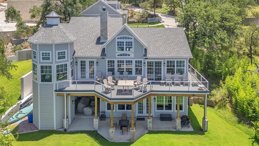 a aerial view of a house with swimming pool and porch