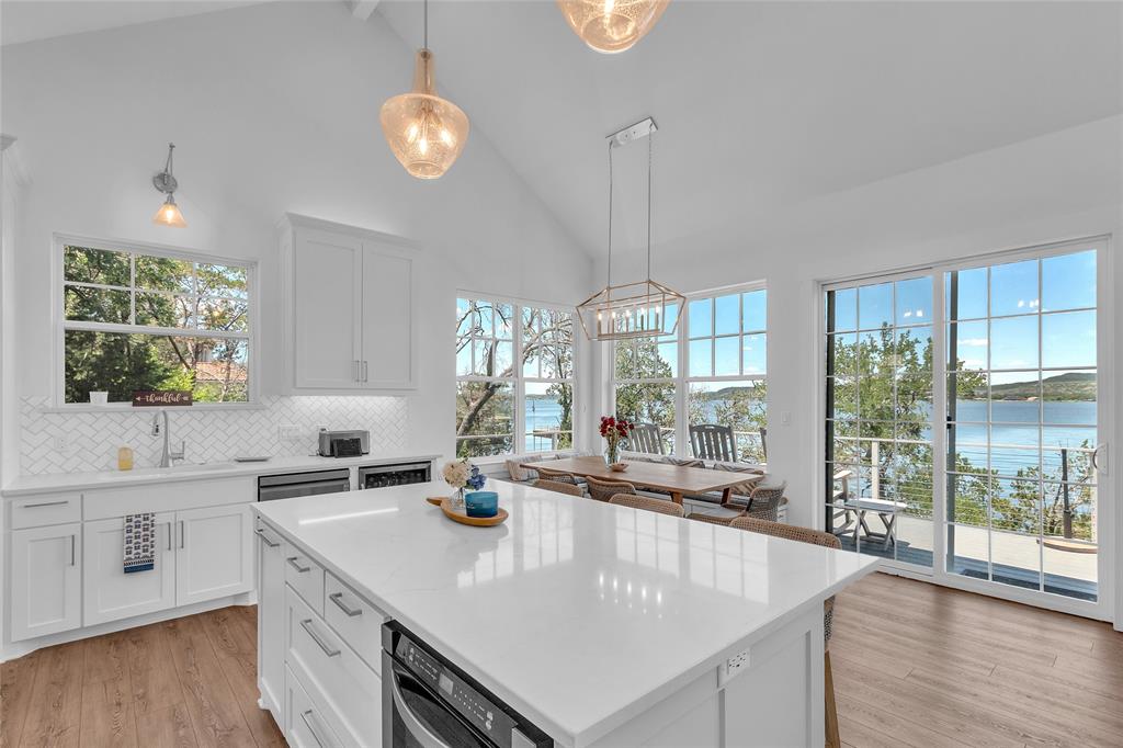2147 Trail Rdg 2 Graford, TX 76449 - Photo 12 of 37 a large kitchen with kitchen island a large counter space windows and appliances
