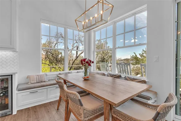 a view of a dining room with furniture window and wooden floor