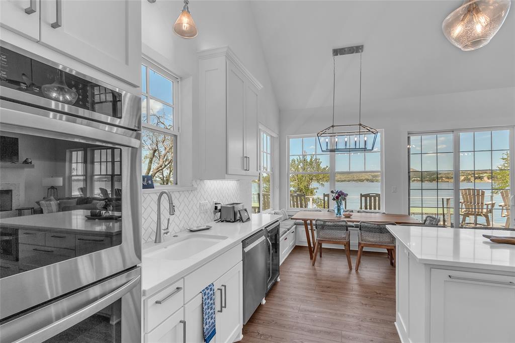 2147 Trail Rdg 2 Graford, TX 76449 - Photo 15 of 37 a large kitchen with stainless steel appliances a lot of counter space and a wooden floors