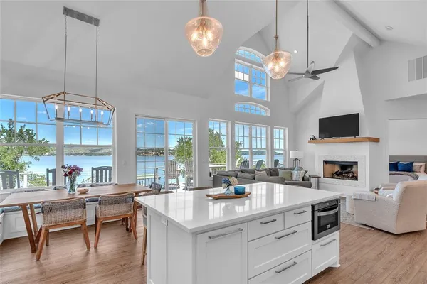 a kitchen with a stove a sink and a fireplace