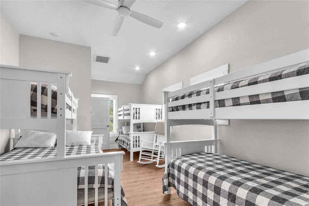 2147 Trail Rdg 2 Graford, TX 76449 - Photo 28 of 37 a bedroom with a bed a lamp and a large window