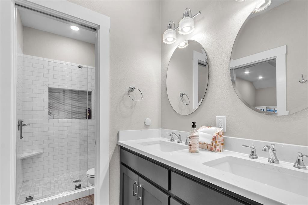 2147 Trail Rdg 2 Graford, TX 76449 - Photo 29 of 37 a bathroom with a double vanity sink mirror and shower