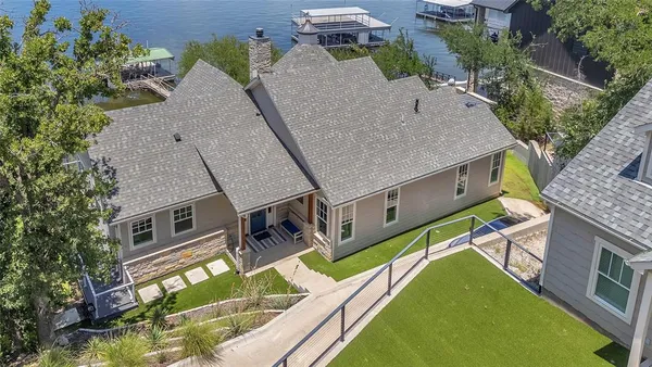 an aerial view of a house with swimming pool