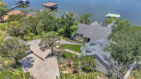 an aerial view of a house with outdoor space