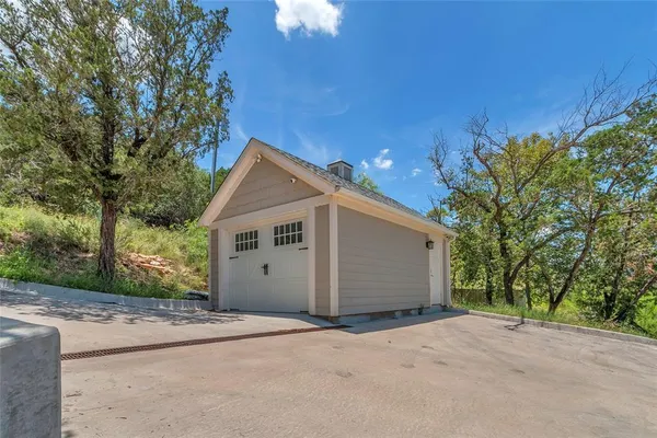 a view of garage and yard