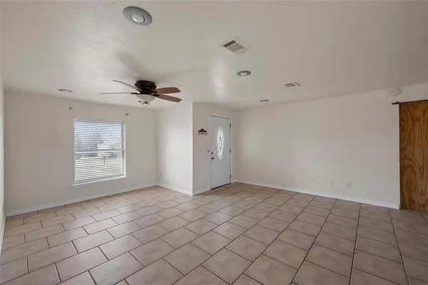a view of an empty room and window