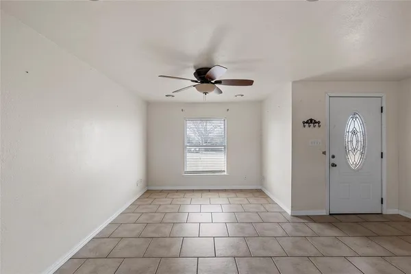 a view of an empty room and window
