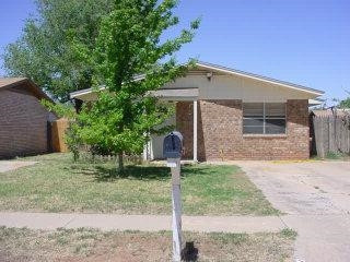 6404 28th Street Lubbock, TX 79407 - Photo 1 of 1 a front view of a house with garden