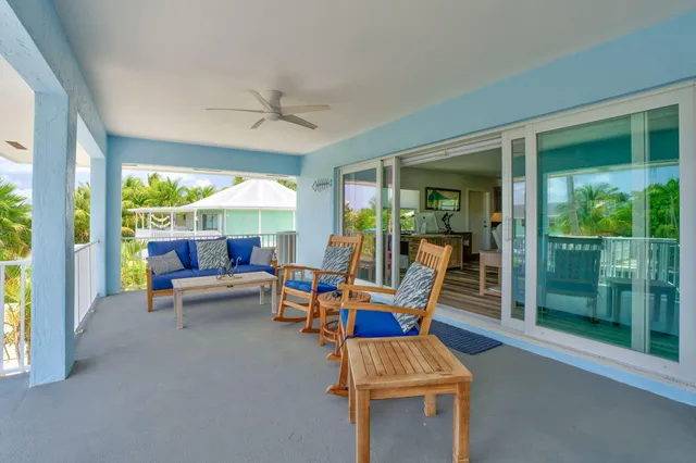 a outdoor space with patio the couches and a dining table with garden view