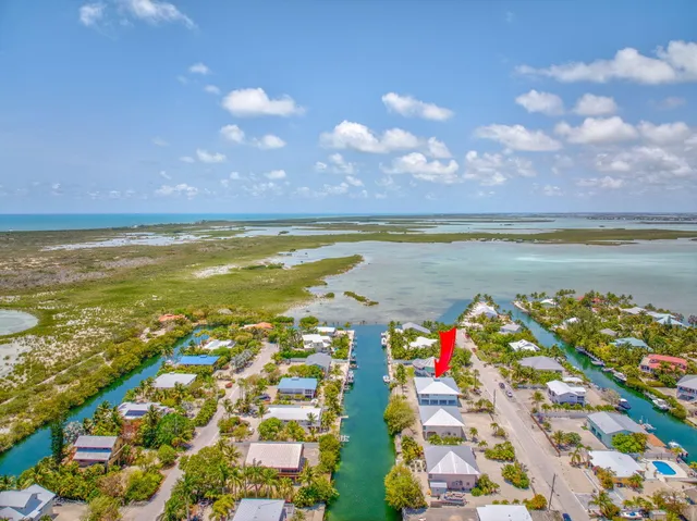 a view of an ocean and city