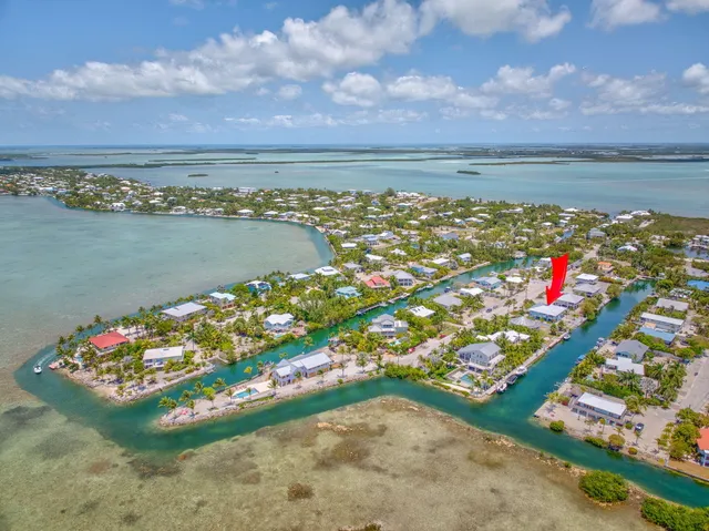 a view of a lake with a house in the background