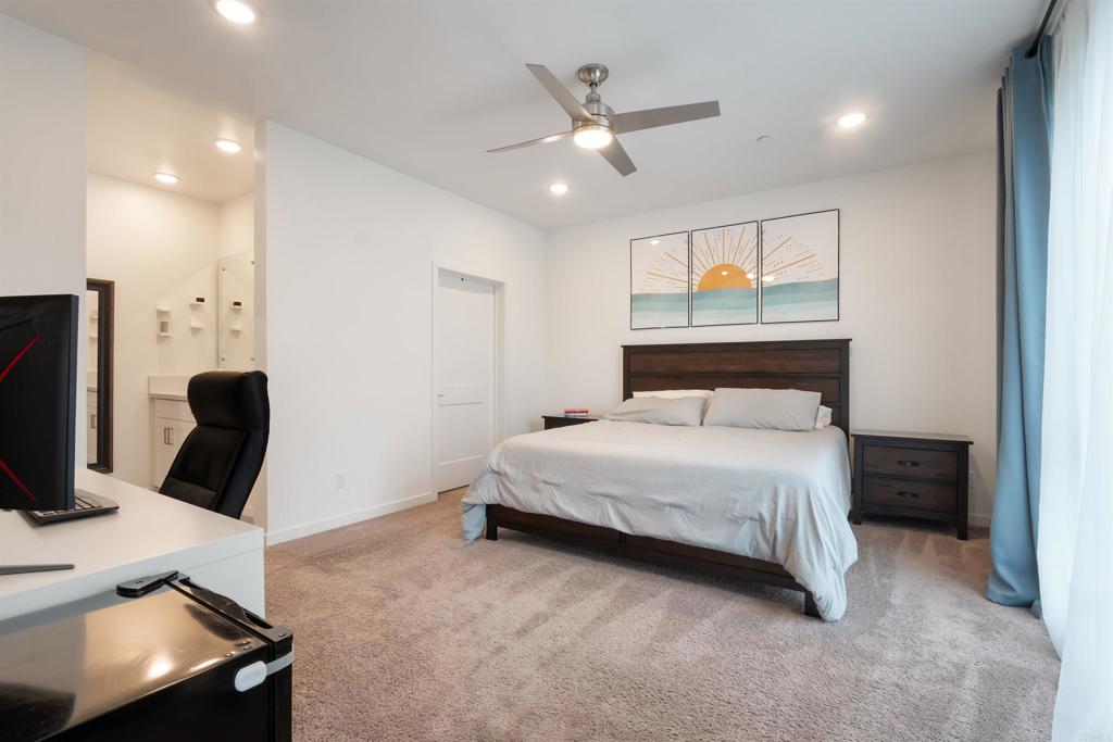 522 South Cleveland Street, Unit 7 Oceanside, CA 92054 - Photo 16 of 24 a bedroom with a bed desk and a window