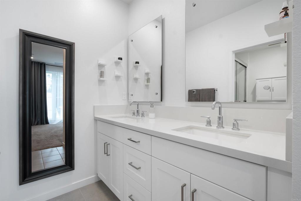 522 South Cleveland Street, Unit 7 Oceanside, CA 92054 - Photo 18 of 24 a bathroom with double sink and a mirror