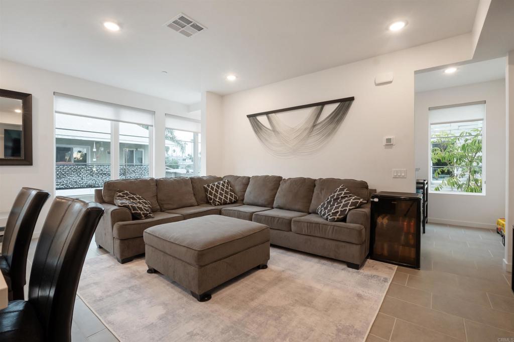 522 South Cleveland Street, Unit 7 Oceanside, CA 92054 - Photo 23 of 24 a living room with a couch and a large window