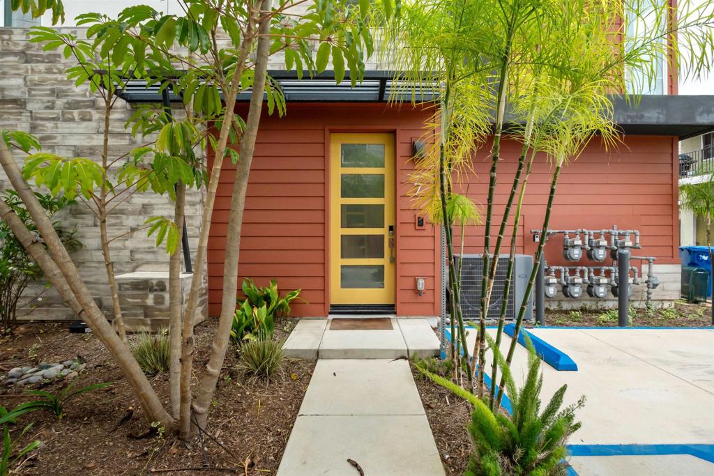 522 South Cleveland Street, Unit 7 Oceanside, CA 92054 - Photo 4 of 24 a house with trees in front of it