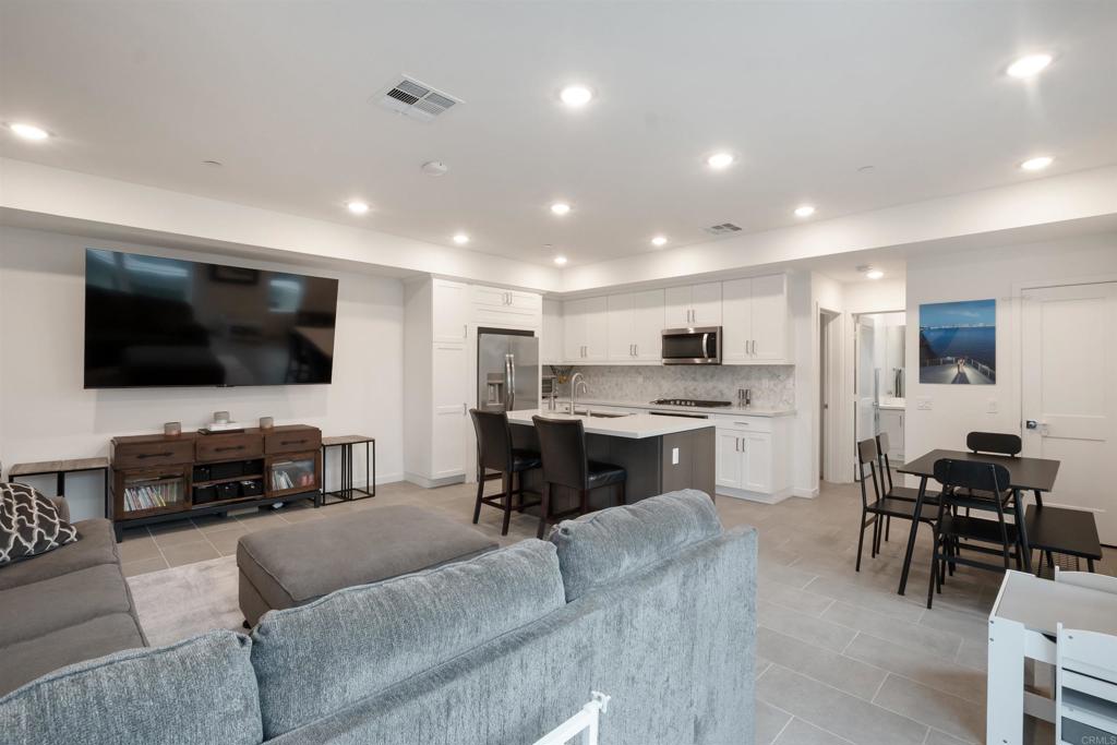 522 South Cleveland Street, Unit 7 Oceanside, CA 92054 - Photo 8 of 24 a living room with furniture and a flat screen tv
