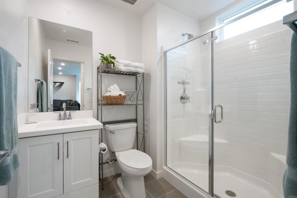 522 South Cleveland Street, Unit 7 Oceanside, CA 92054 - Photo 9 of 24 a bathroom with a sink a toilet and shower