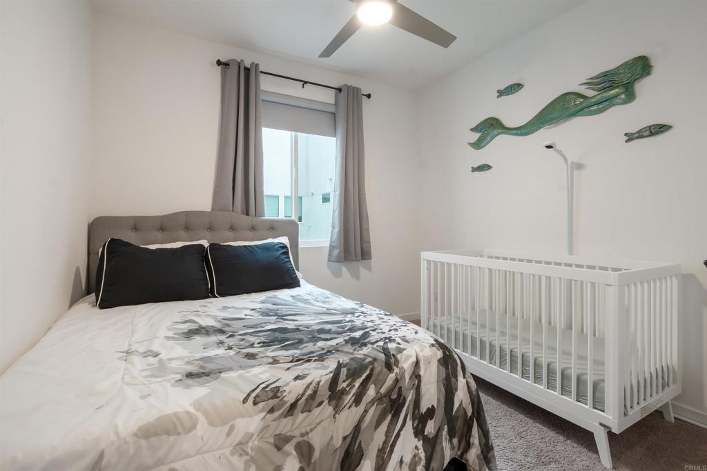 522 South Cleveland Street, Unit 7 Oceanside, CA 92054 - Photo 10 of 24 a bedroom with a bed and a window