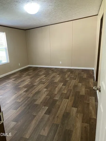 a kitchen with a refrigerator and cabinets
