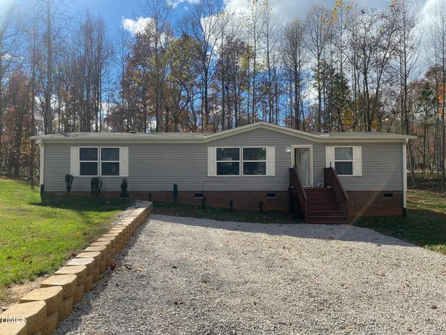 a house view with a backyard space