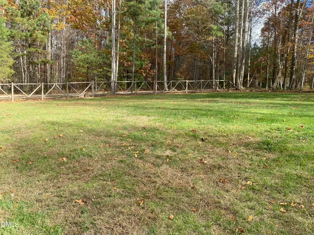 a backyard of apartments with large trees