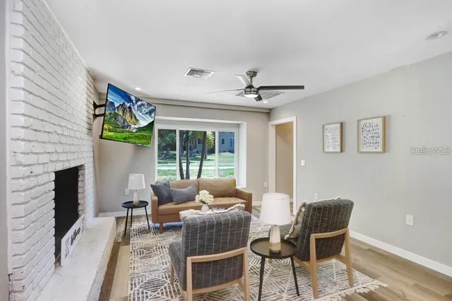 a living room with furniture and a fireplace