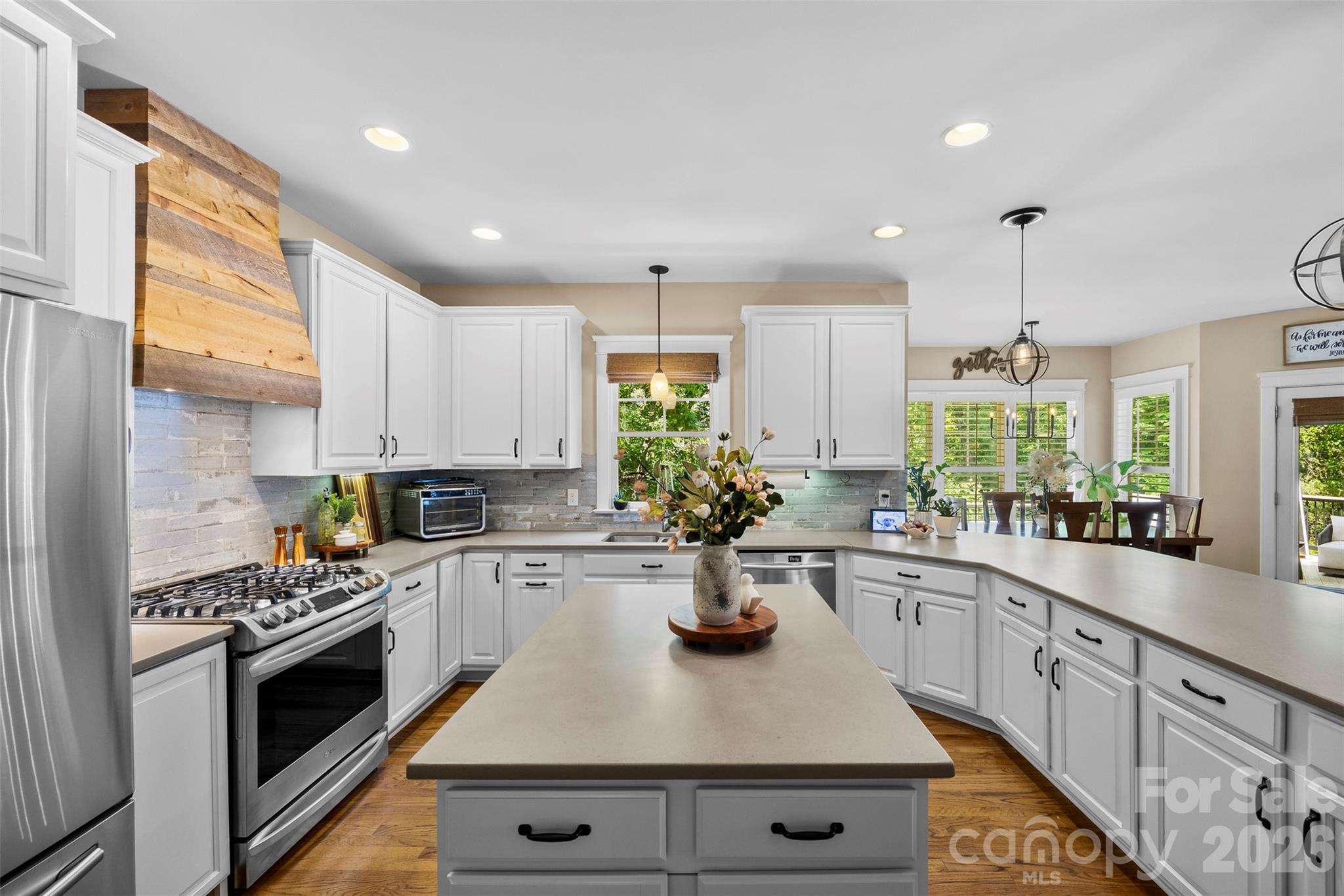 606 Andover Lane Tega Cay, SC 29708 - Photo 9 of 48 a kitchen with sink a stove and cabinets