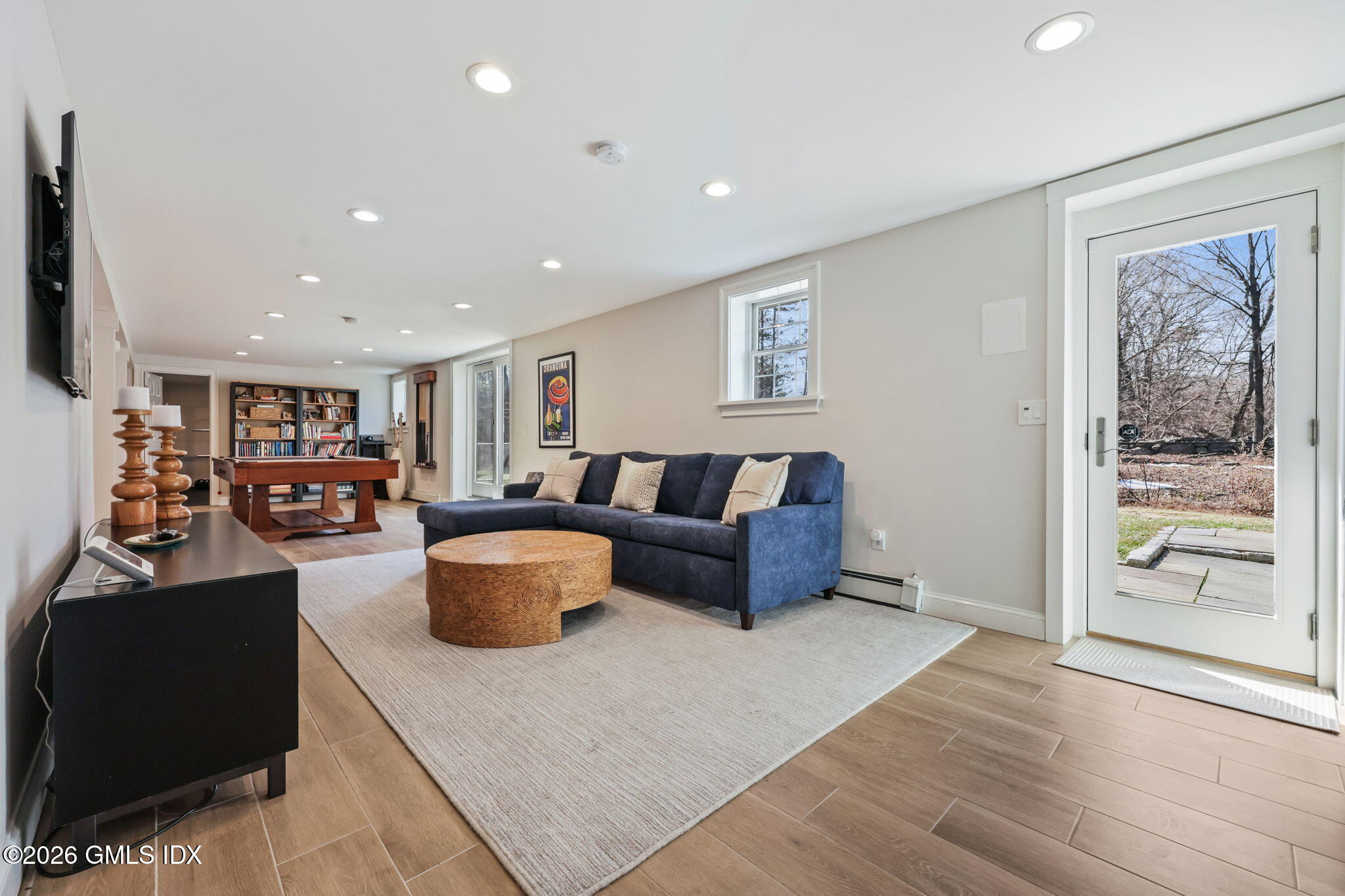 97 Davenport Ridge Lane Stamford, CT 06903 - Photo 24 of 31 a living room with furniture and a flat screen tv