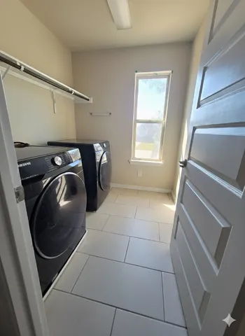 a utility room with dryer and washer