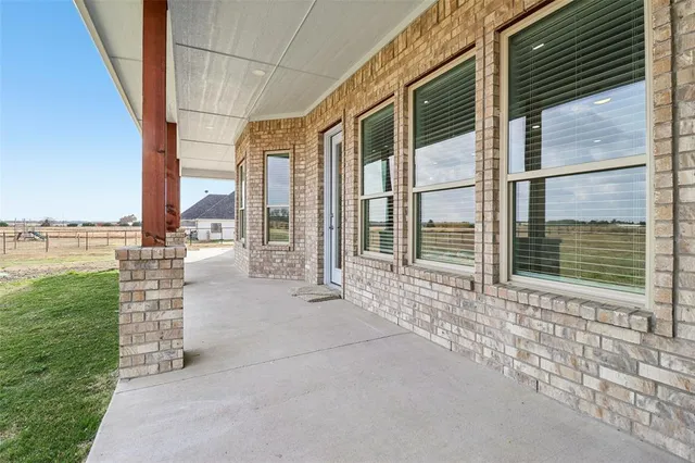 a view of a garden with an outdoor seating