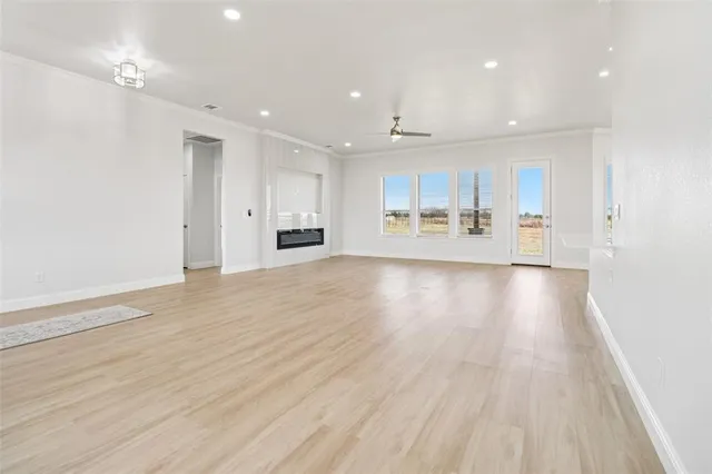 a view of a kitchen with wooden floor
