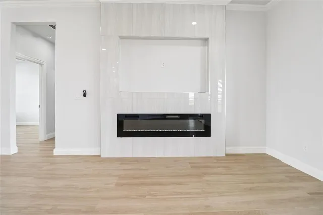 a white cabinetry with wooden floor