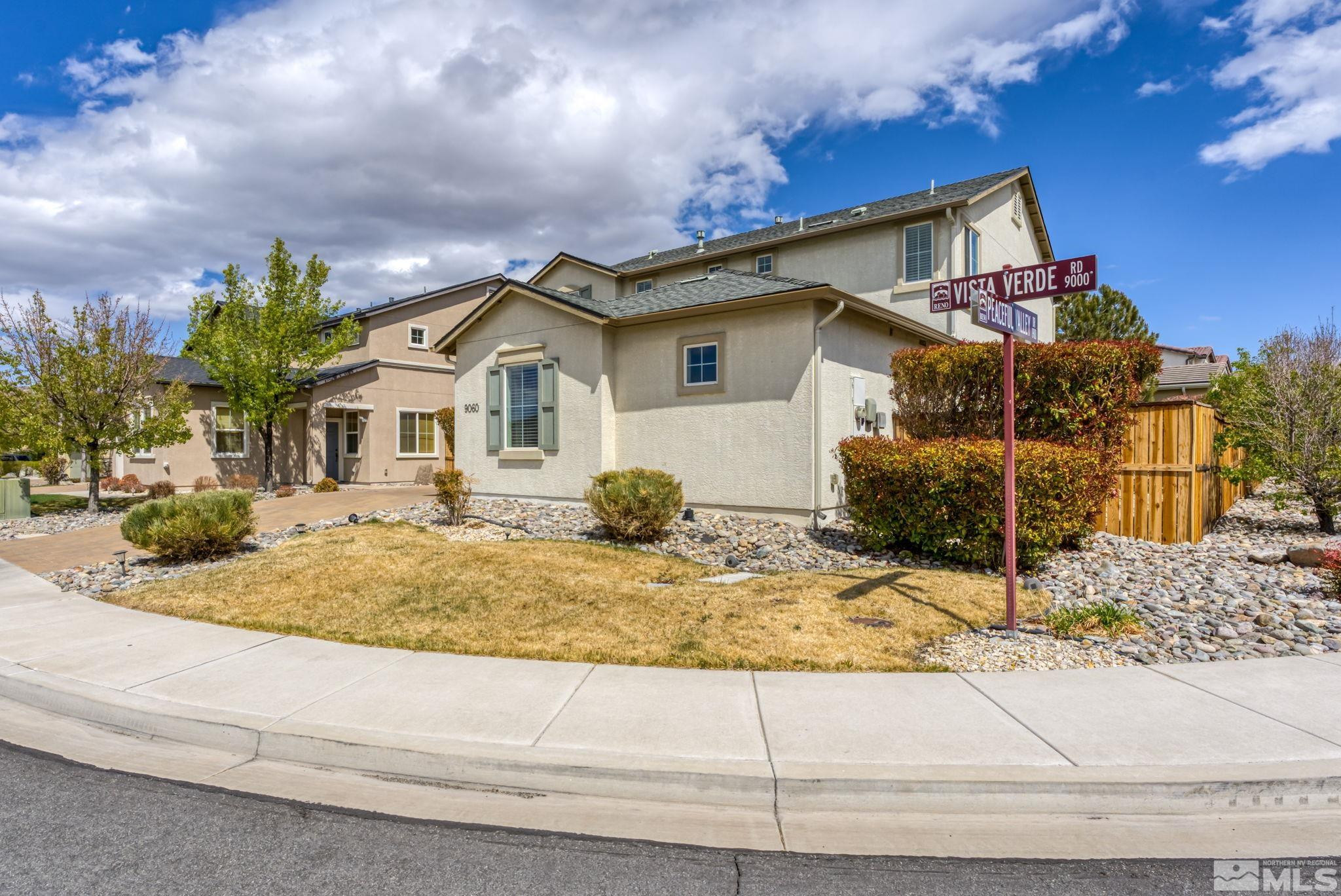 9060 Vista Verde Road Reno, NV 89521 - Photo 3 of 33 a view of a house with a small yard and potted plants