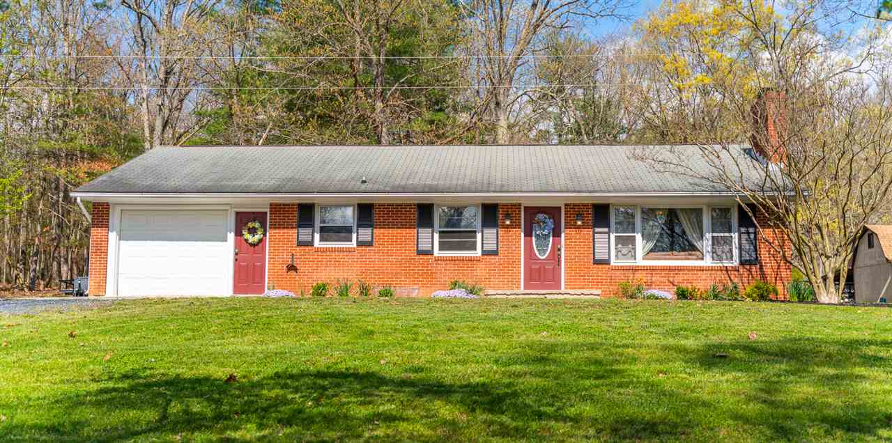 275 Swoope Road Swoope, VA 24479 - Photo 1 of 41 a front view of house with yard and trees in the background