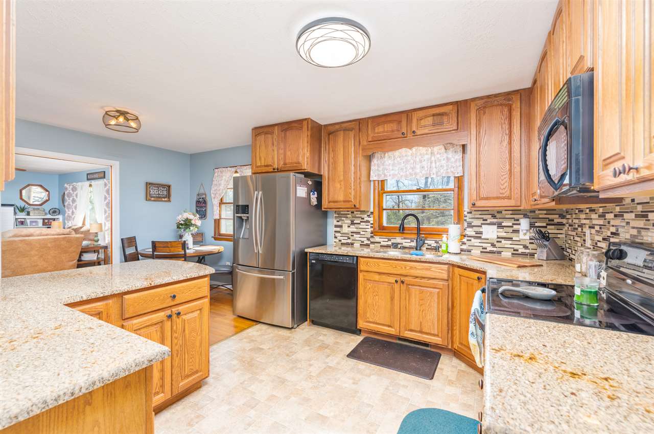275 Swoope Road Swoope, VA 24479 - Photo 20 of 41 a kitchen with stainless steel appliances granite countertop a sink stove and refrigerator