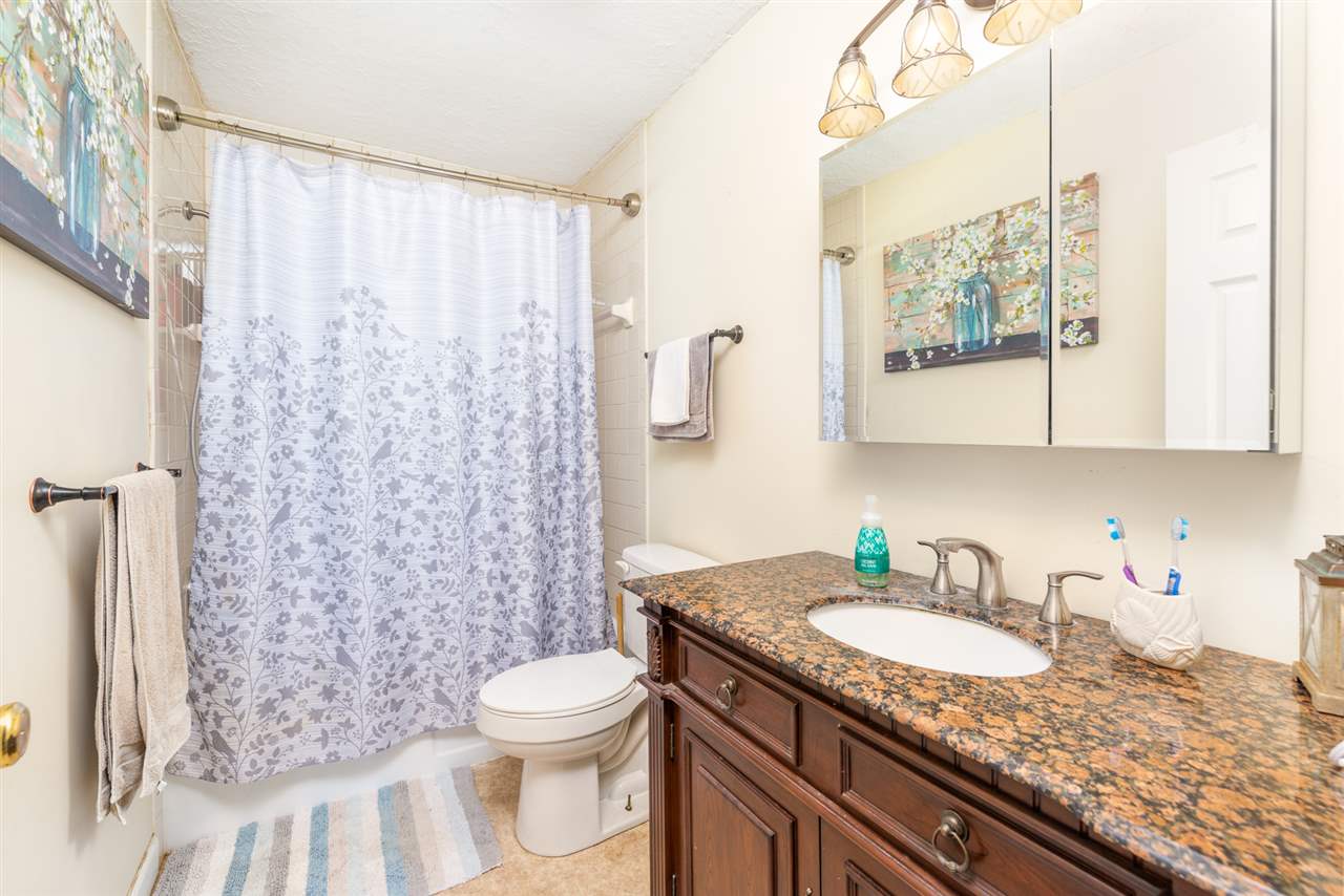 275 Swoope Road Swoope, VA 24479 - Photo 26 of 41 a bathroom with a granite countertop sink toilet and shower