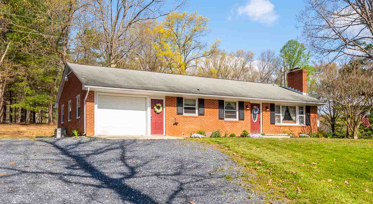 275 Swoope Road Swoope, VA 24479 - Photo 3 of 41 a front view of a house with a yard and trees