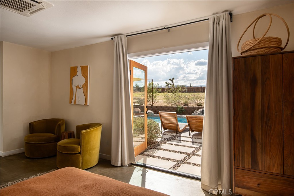 382 Cherokee Trail Yucca Valley, CA 92284 - Photo 16 of 33 a living room with furniture and a window