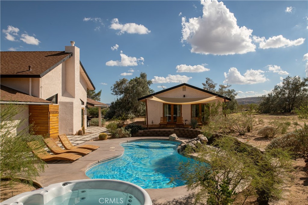 382 Cherokee Trail Yucca Valley, CA 92284 - Photo 26 of 33 a view of a house with yard porch and furniture