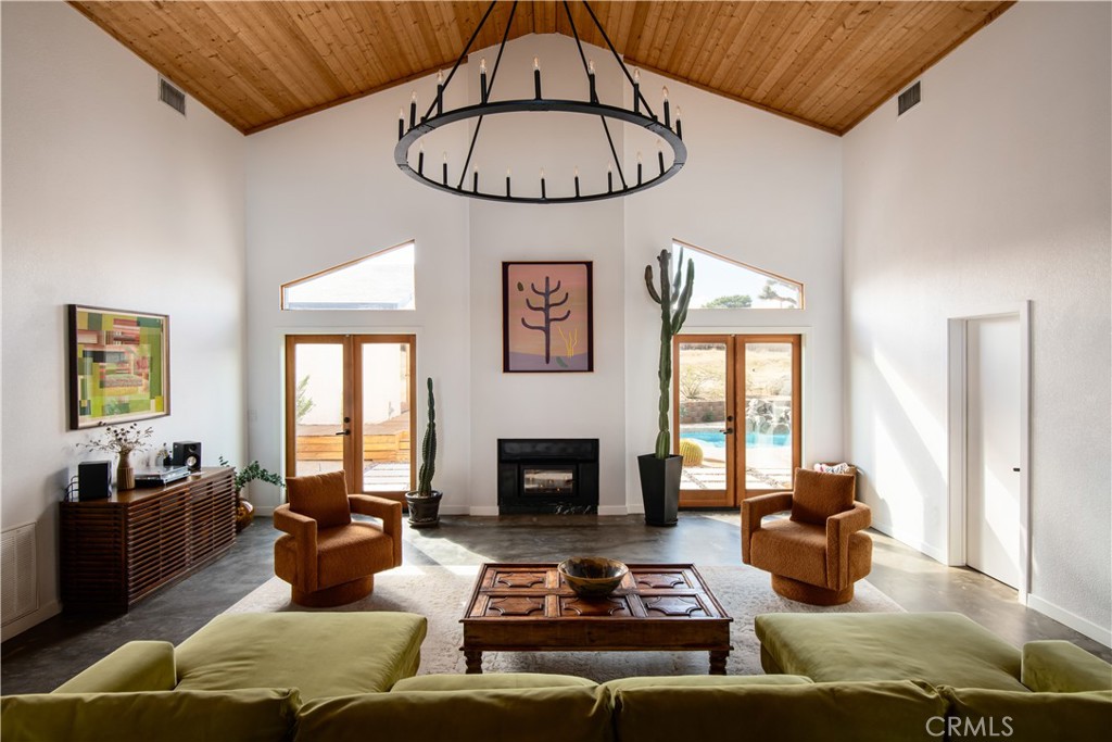 382 Cherokee Trail Yucca Valley, CA 92284 - Photo 4 of 33 a living room with furniture fireplace and window