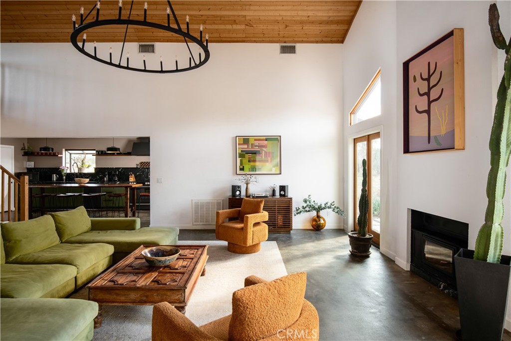 382 Cherokee Trail Yucca Valley, CA 92284 - Photo 7 of 33 a living room with furniture and a wooden floor