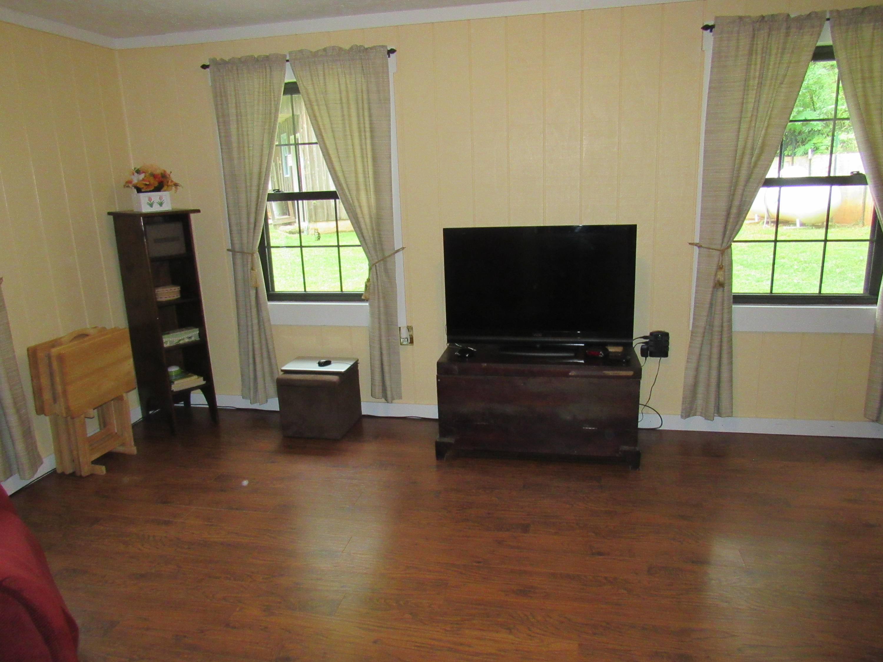 2700 Johnny's Ridge Road Ferrum, VA 24088 - Photo 2 of 32 a living room with furniture and a flat screen tv