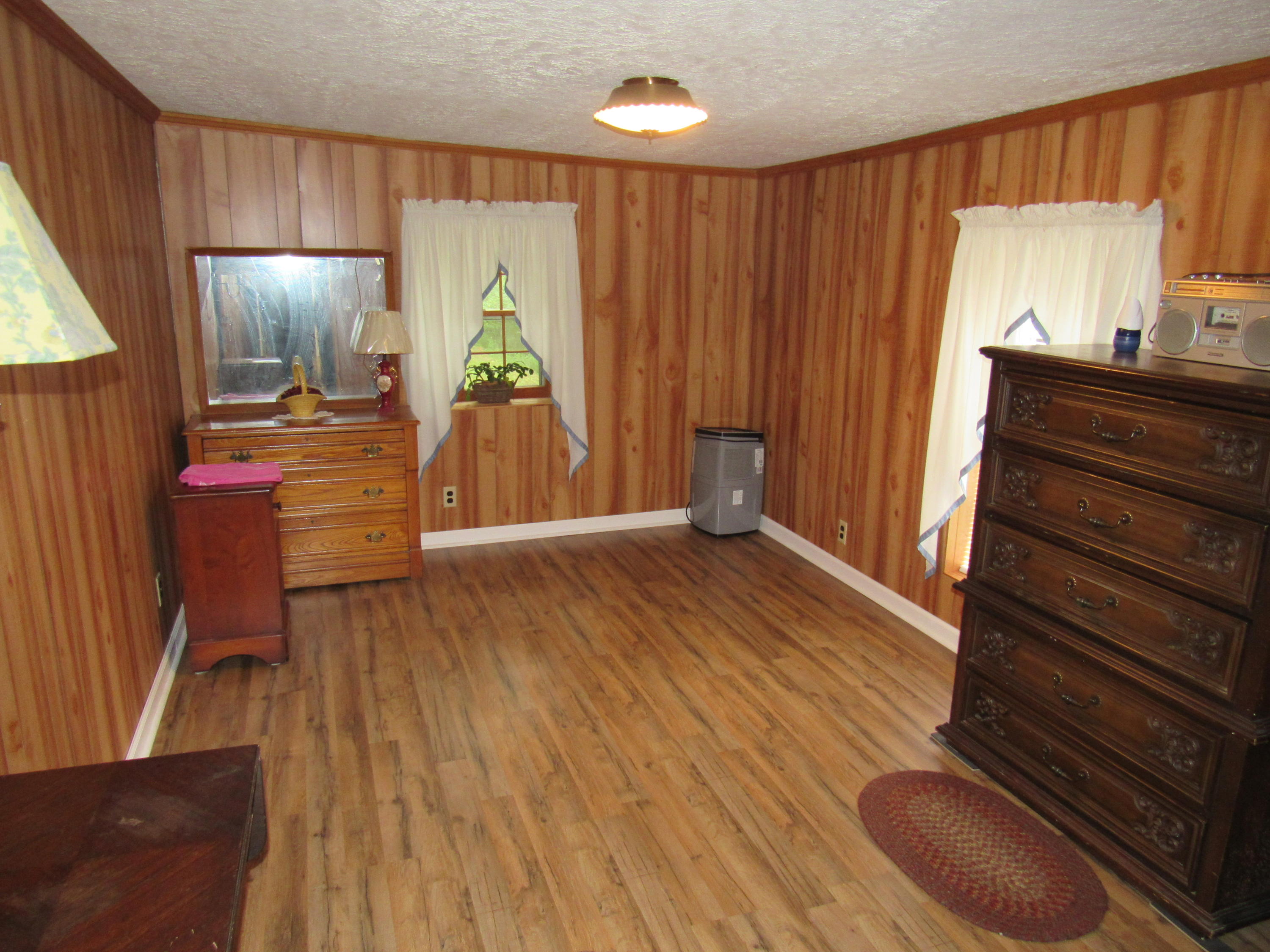 2700 Johnny's Ridge Road Ferrum, VA 24088 - Photo 12 of 32 a view of a hallway with wooden floor and furniture