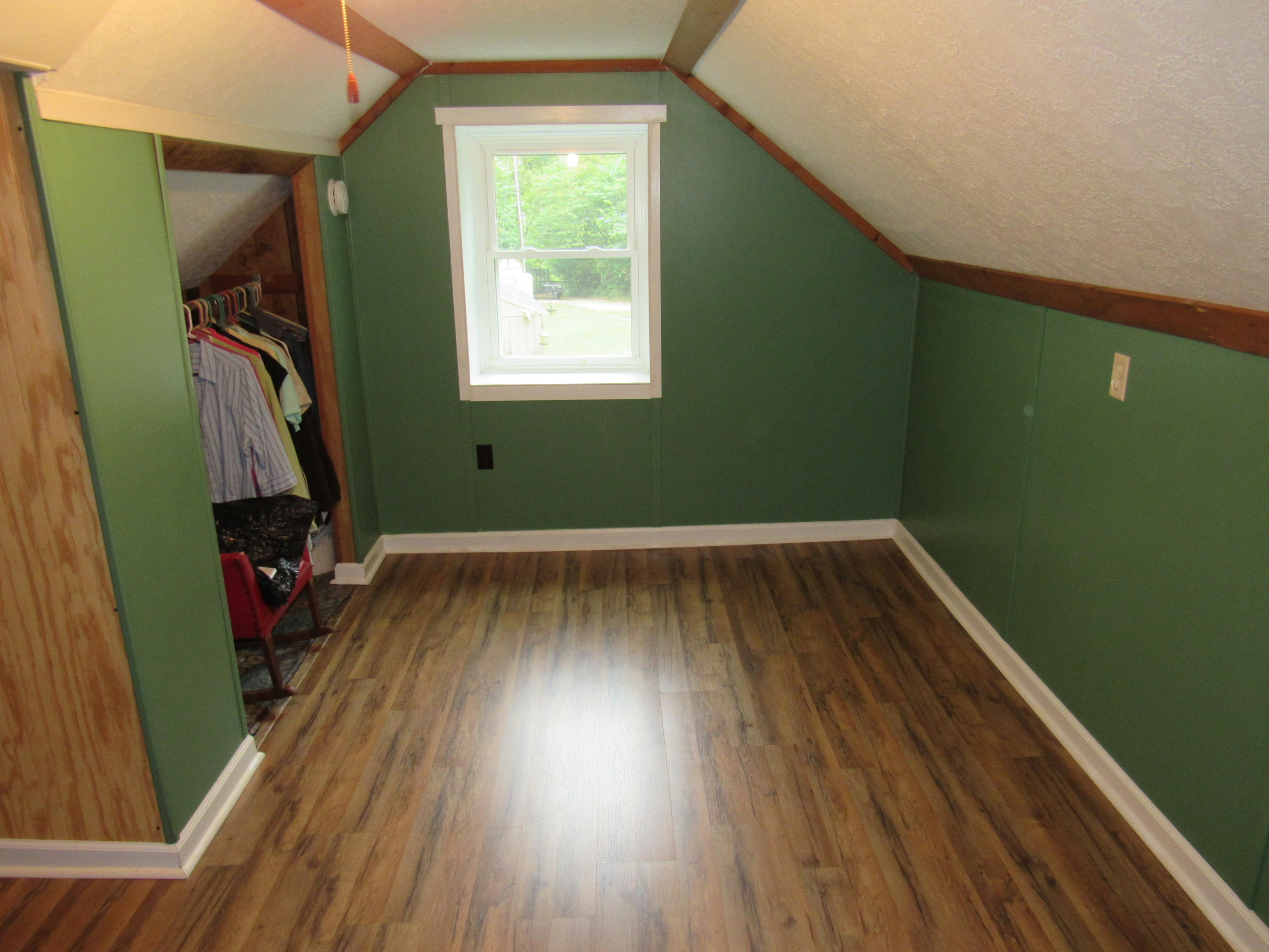 2700 Johnny's Ridge Road Ferrum, VA 24088 - Photo 13 of 32 a view of a room with wooden floor and a window