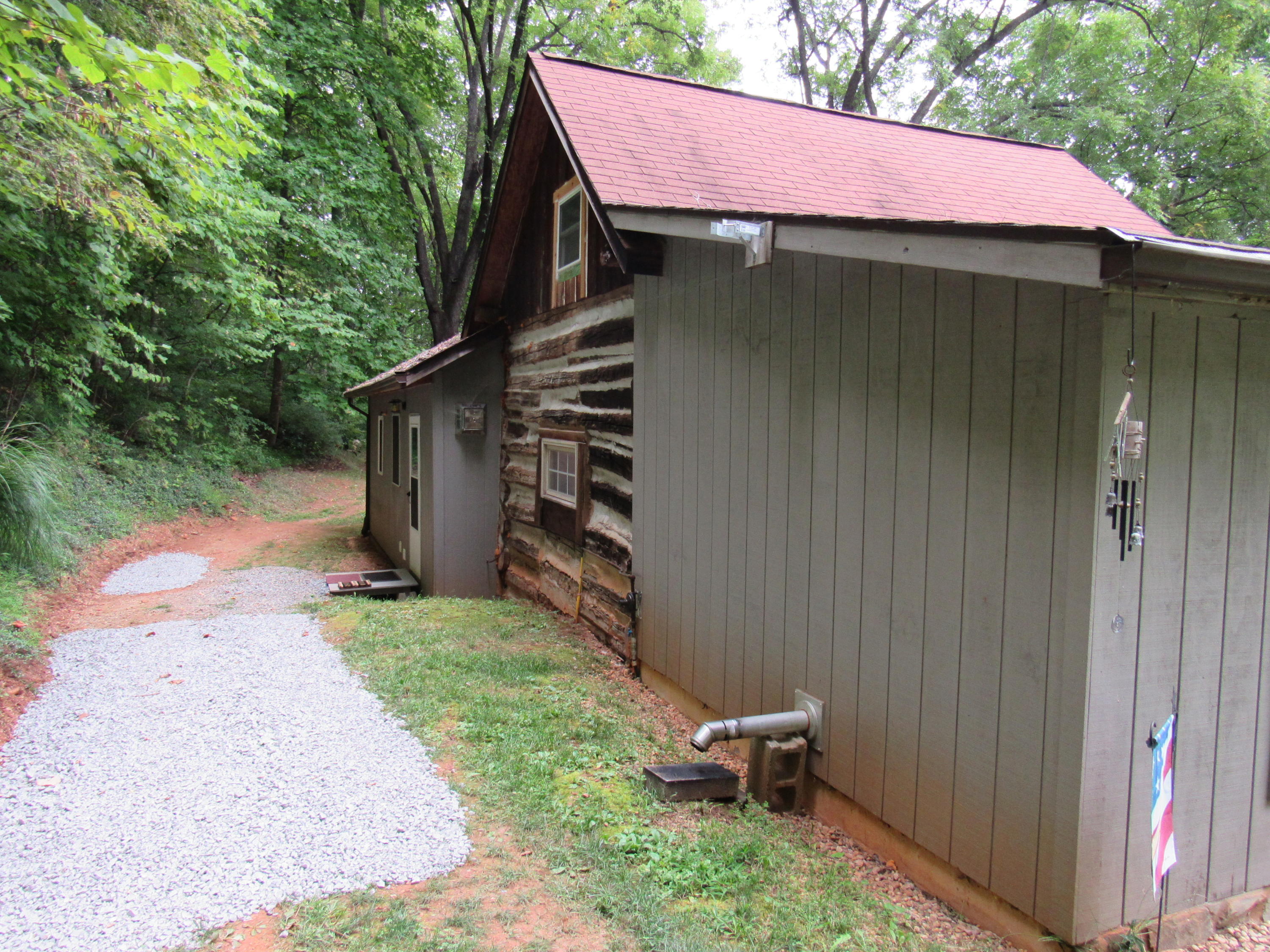 2700 Johnny's Ridge Road Ferrum, VA 24088 - Photo 22 of 32 a backyard of a house with table and chairs