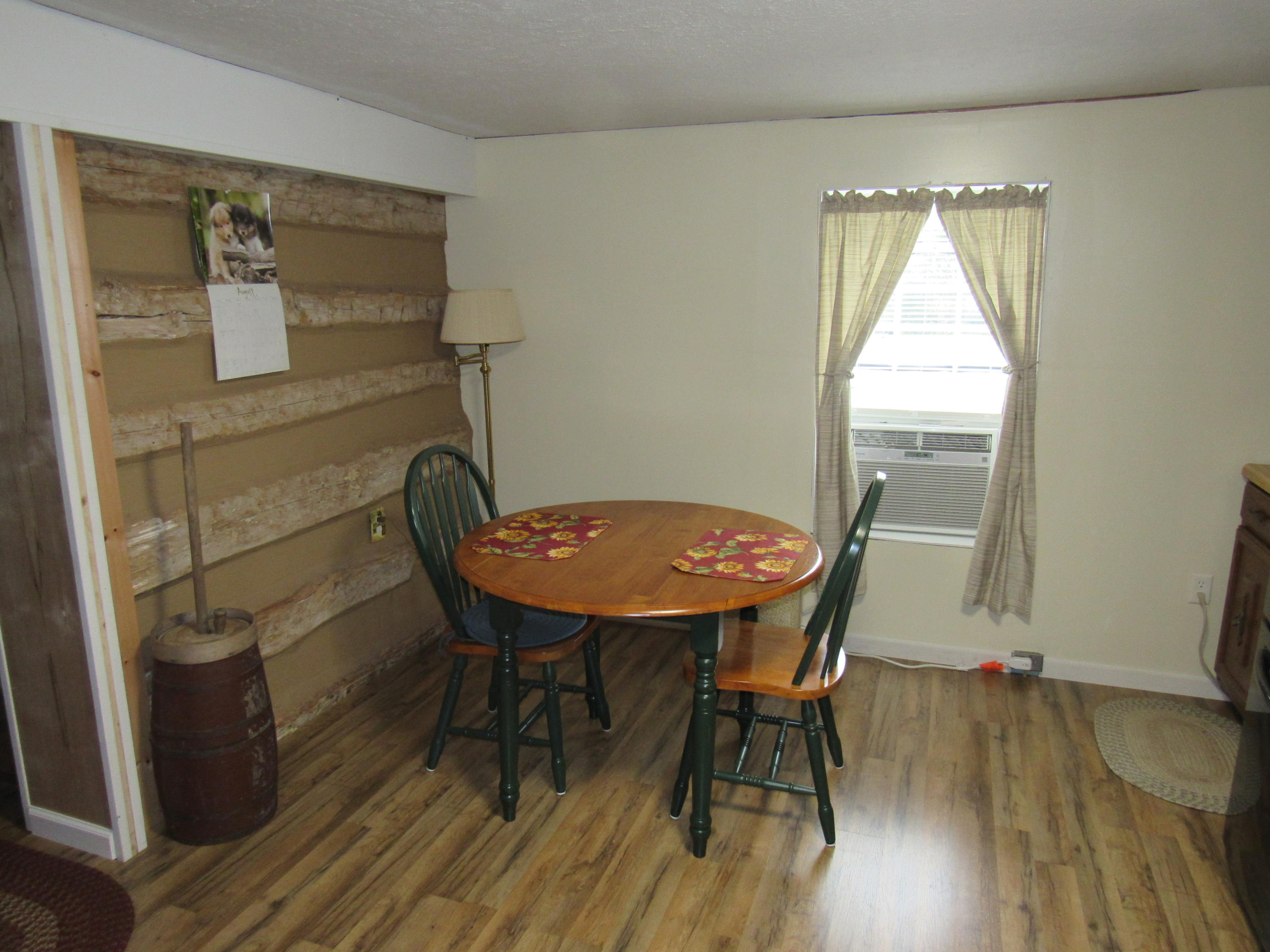 2700 Johnny's Ridge Road Ferrum, VA 24088 - Photo 5 of 32 a view of a dining room with furniture and wooden floor