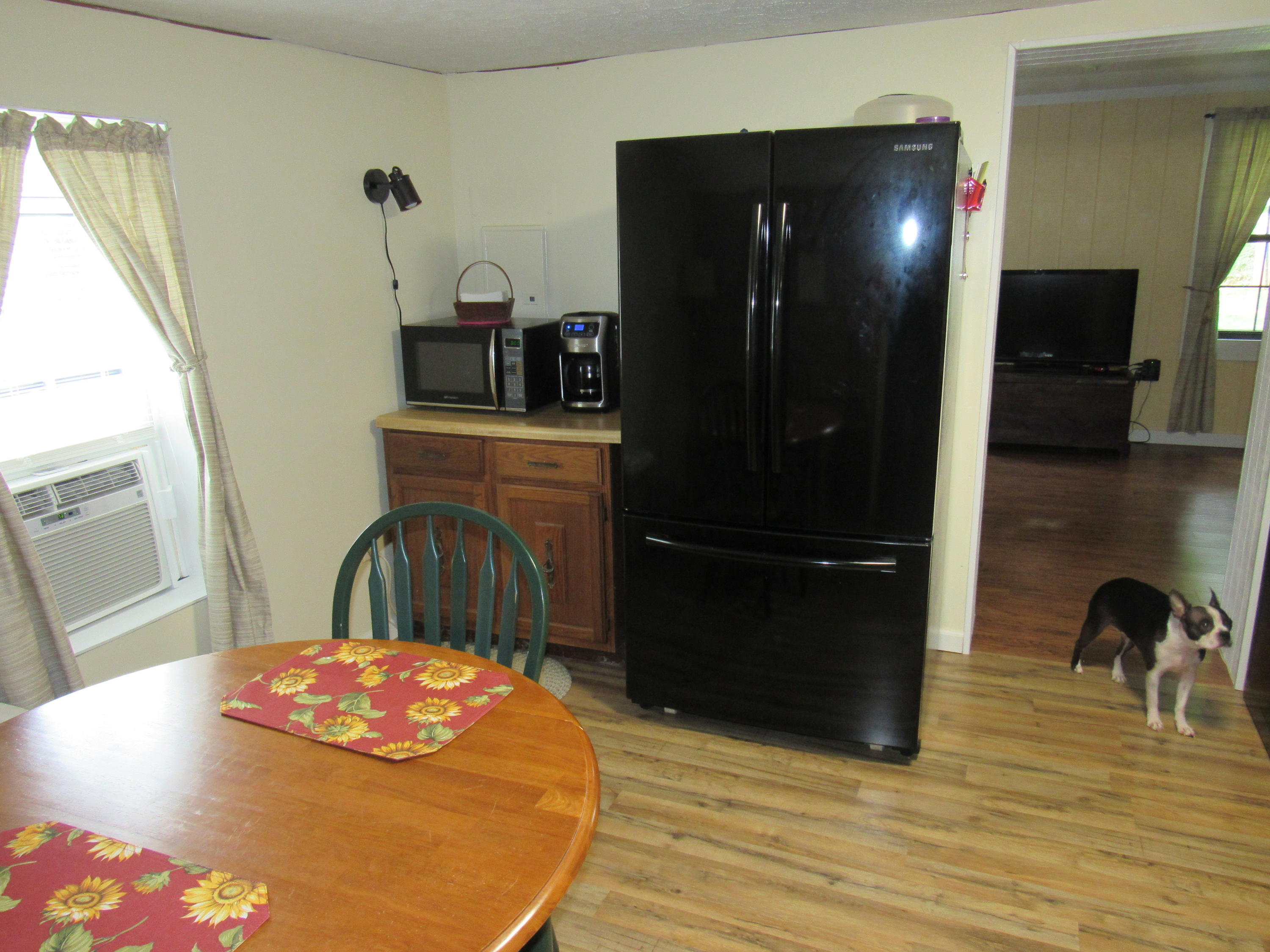 2700 Johnny's Ridge Road Ferrum, VA 24088 - Photo 6 of 32 a view of a dining room with furniture and wooden floor